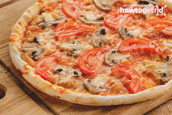 Pizza with champignons in a pan