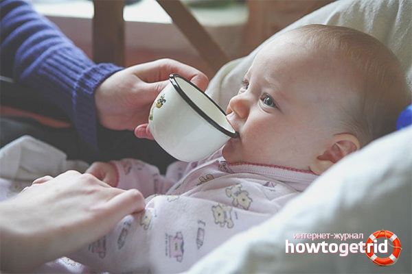 Teaching a child to drink from a mug