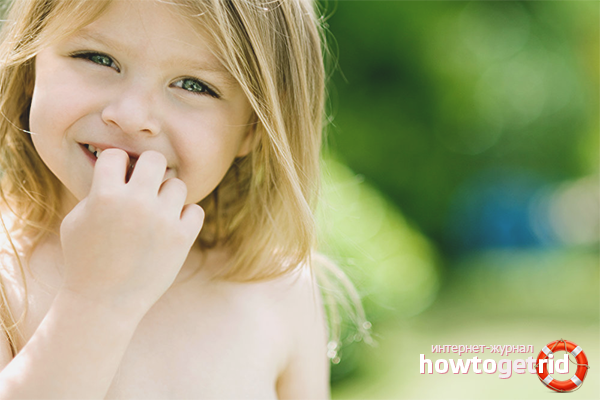 The child bites his nails